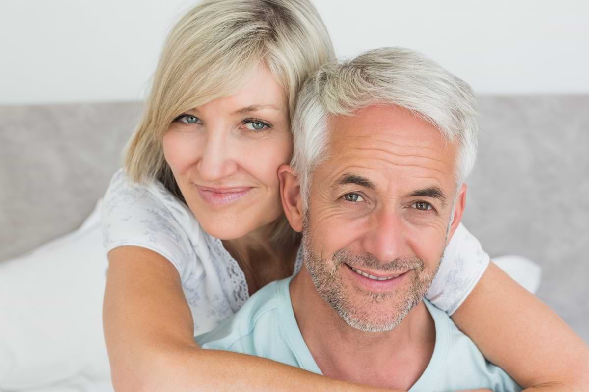 Man and woman laying in bed